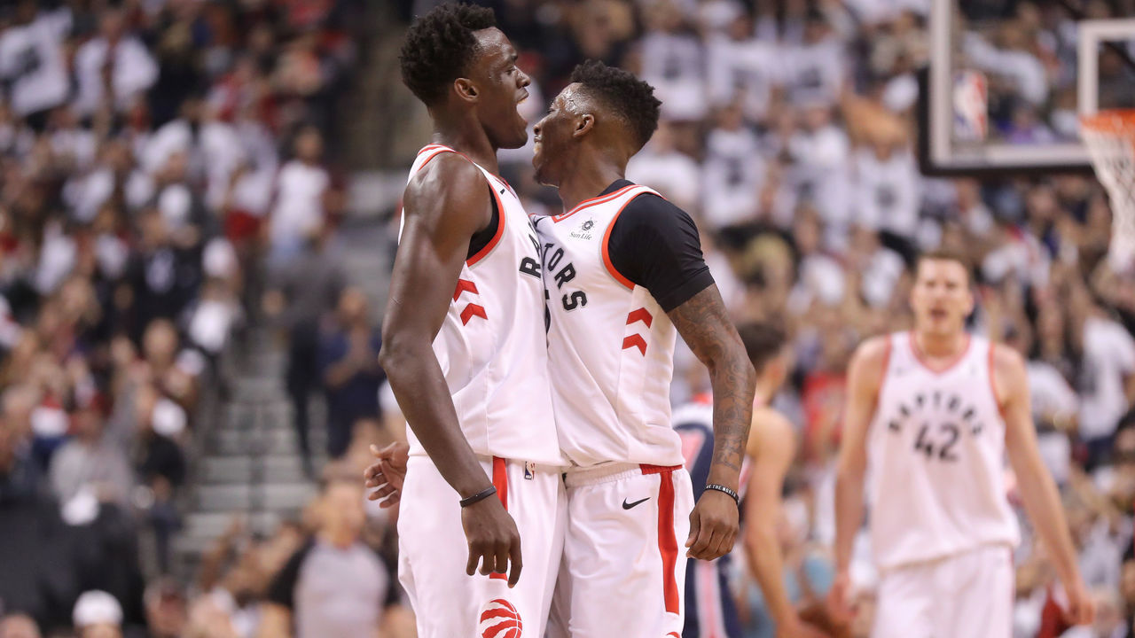 TORONTO, ON - APRIL 14: Delon Wright #55 of the Toronto Raptors celebrates his three-pointer with Pascal Siakam #43 against the Washington Wizards in the second quarter during Game One of the first round of the 2018 NBA Playoffs at Air Canada Centre on April 14, 2018 in Toronto, Canada.