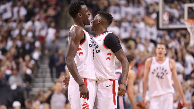 TORONTO, ON - APRIL 14: Delon Wright #55 of the Toronto Raptors celebrates his three-pointer with Pascal Siakam #43 against the Washington Wizards in the second quarter during Game One of the first round of the 2018 NBA Playoffs at Air Canada Centre on April 14, 2018 in Toronto, Canada.