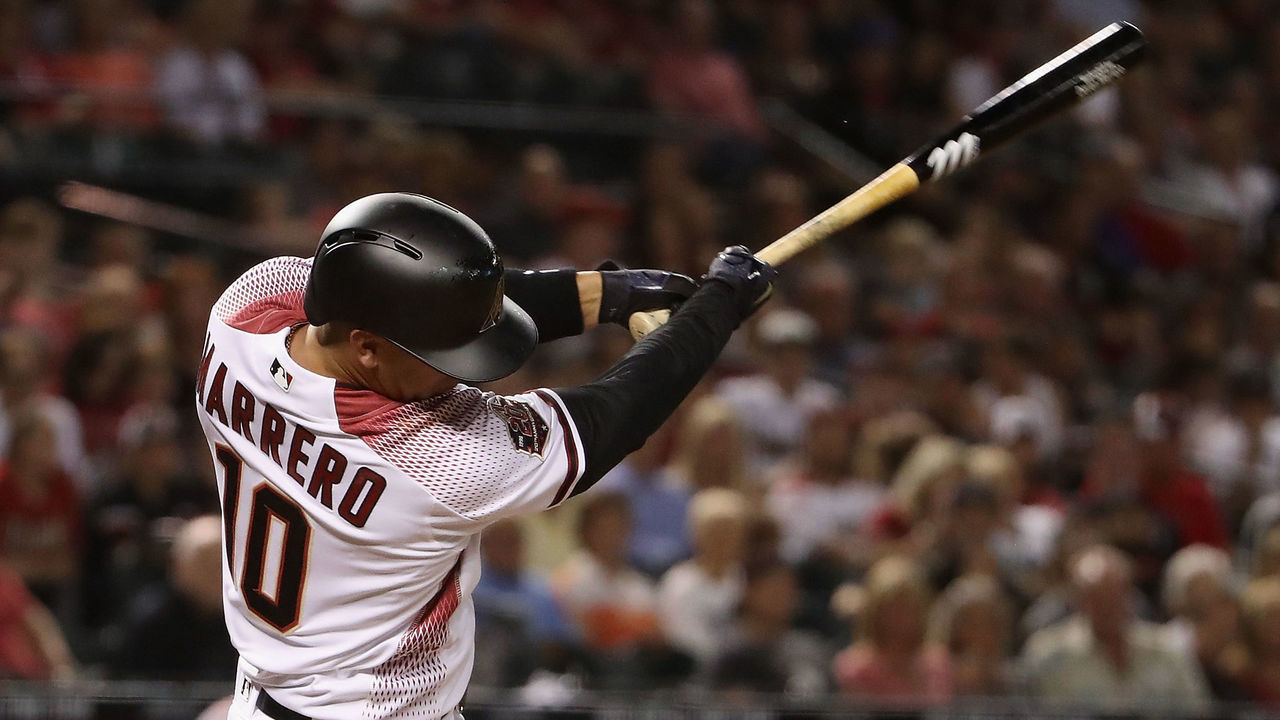 PHOENIX, AZ - MARCH 29: Deven Marrero #10 of the Arizona Diamondbacks hits a RBI single against the Colorado Rockies during the seventh inning of the opening day MLB game at Chase Field on March 29, 2018 in Phoenix, Arizona.