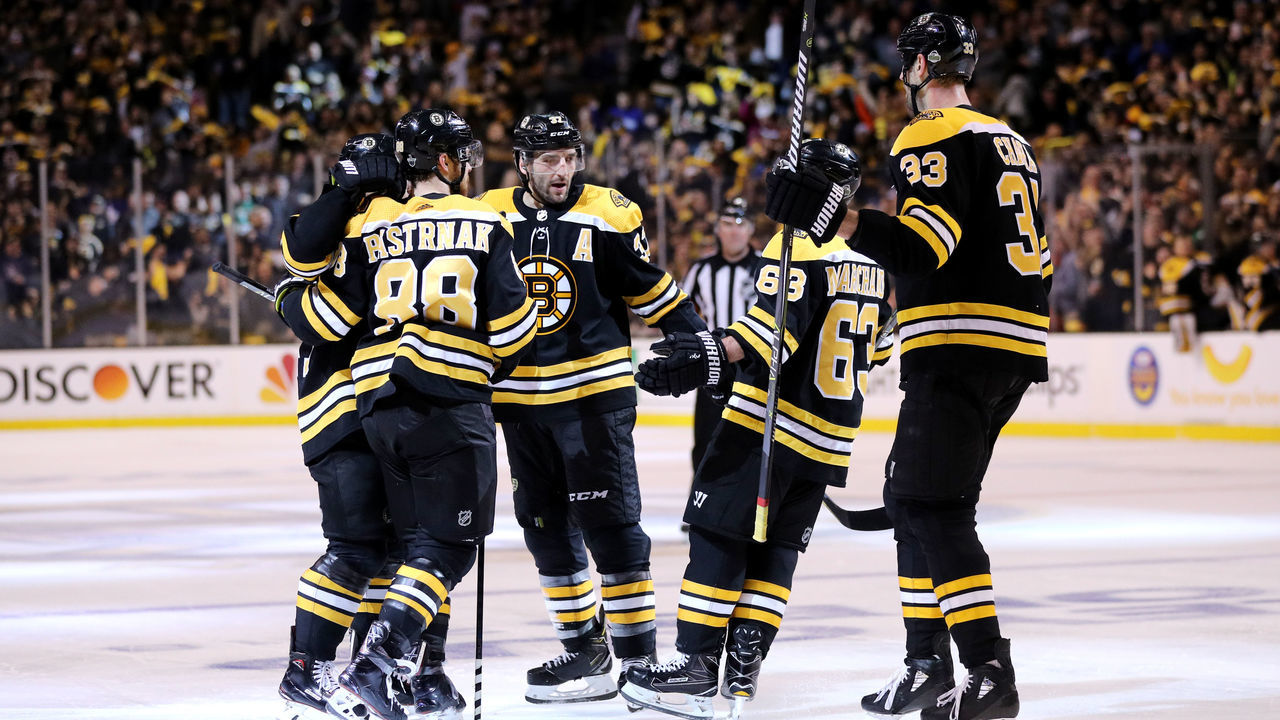 BOSTON, MA - APRIL 14: David Pastrnak #88 of the Boston Bruins, right, celebrates with Patrice Bergeron #37, Brad Marchand #63 and Zdeno Chara #33 after scoring a goal against the Toronto Maple Leafs during the third period of Game Two of the Eastern Conference First Round during the 2018 NHL Stanley Cup Playoffs at TD Garden on April 14, 2018 in Boston, Massachusetts. The Bruins defeat the Leafs 7-3.