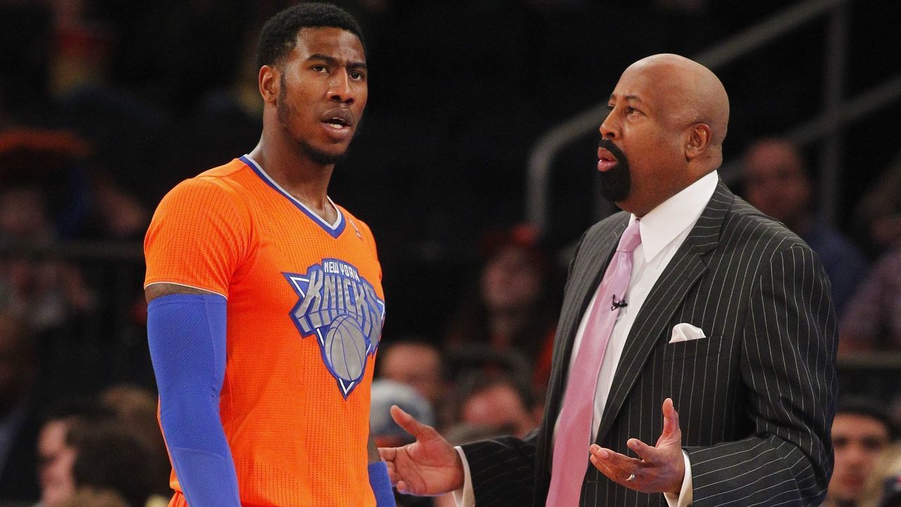 NEW YORK, NY - DECEMBER 25: Iman Shumpert #21 of the New York Knicks talks with head coach Mike Woodson during a game against the Oklahoma City Thunder at Madison Square Garden on December 25, 2013 in New York City. The Thunder defeated the Knicks 123-94. NOTE TO USER: User expressly acknowledges and agrees that, by downloading and/or using this photograph, user is consenting to the terms and conditions of the Getty Images License Agreement.