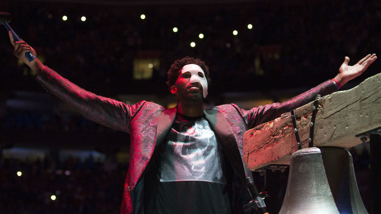 PHILADELPHIA, PA - APRIL 14: Joel Embiid #21 of the Philadelphia 76ers rings the bell prior to Game One of the first round of the 2018 NBA Playoff against the Miami Heat at Wells Fargo Center on April 14, 2018 in Philadelphia, Pennsylvania.