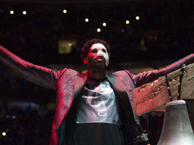 PHILADELPHIA, PA - APRIL 14: Joel Embiid #21 of the Philadelphia 76ers rings the bell prior to Game One of the first round of the 2018 NBA Playoff against the Miami Heat at Wells Fargo Center on April 14, 2018 in Philadelphia, Pennsylvania.