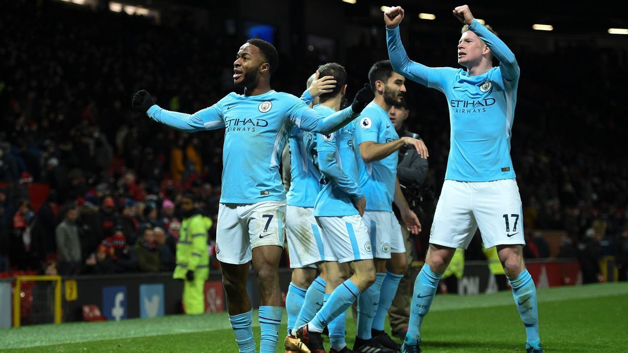 Manchester City's English midfielder Raheem Sterling (L) and Manchester City's Belgian midfielder Kevin De Bruyne (R) celebrate at the end during the English Premier League football match between Manchester United and Manchester City at Old Trafford in Manchester, north west England, on December 10, 2017. / AFP PHOTO / Oli SCARFF /