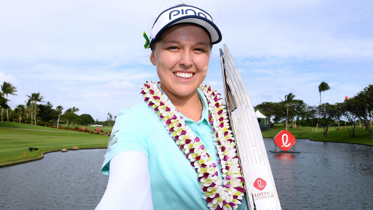 KAPOLEI, HI - APRIL 14: Brooke Henderson of Canada imiates a selfie as she poses with the trophy after a four shot victory in the LPGA LOTTE Championship at the Ko Olina Golf Club on April 14, 2018 in Kapolei, Hawaii.