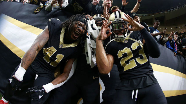 NEW ORLEANS, LA - DECEMBER 24: Alvin Kamara #41 of the New Orleans Saints, Marshon Lattimore #23 and Michael Thomas #13 celebrate after a game against the Atlanta Falcons at the Mercedes-Benz Superdome on December 24, 2017 in New Orleans, Louisiana.