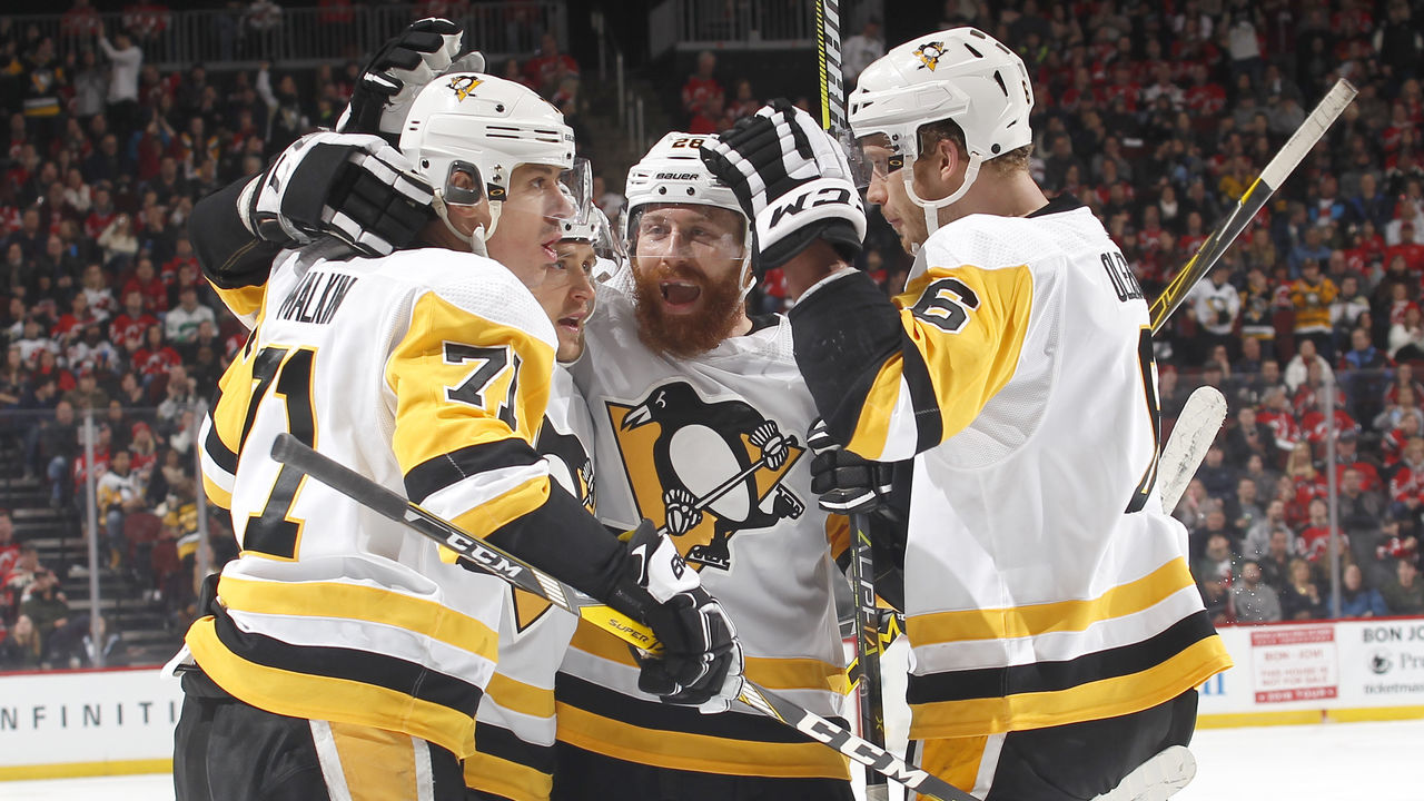 NEWARK, NJ - FEBRUARY 3: Evgeni Malkin #71 of the Pittsburgh Penguins celebrates scoring a goal with teammates during an NHL hockey game against the New Jersey Devils at Prudential Center on February 3, 2018 in Newark, New Jersey.