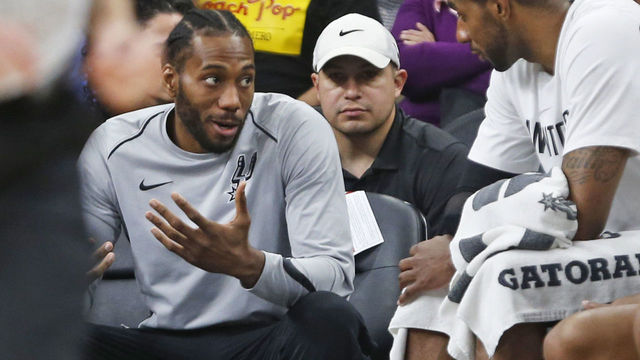 SAN ANTONIO,TX - MARCH 13 : Kawhi Leonard #2 of the San Antonio Spurs still not playing talks with teammate LaMarcus Aldridge #12 of the San Antonio Spurs during game against the Orlando Magic at AT&T Center on March 13, 2018 in San Antonio, Texas. NOTE TO USER: User expressly acknowledges and agrees that , by downloading and or using this photograph, User is consenting to the terms and conditions of the Getty Images License Agreement.