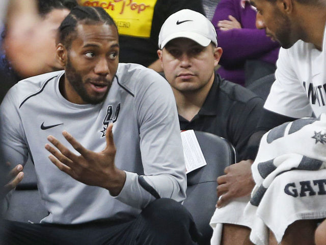 SAN ANTONIO,TX - MARCH 13 : Kawhi Leonard #2 of the San Antonio Spurs still not playing talks with teammate LaMarcus Aldridge #12 of the San Antonio Spurs during game against the Orlando Magic at AT&T Center on March 13, 2018 in San Antonio, Texas. NOTE TO USER: User expressly acknowledges and agrees that , by downloading and or using this photograph, User is consenting to the terms and conditions of the Getty Images License Agreement.