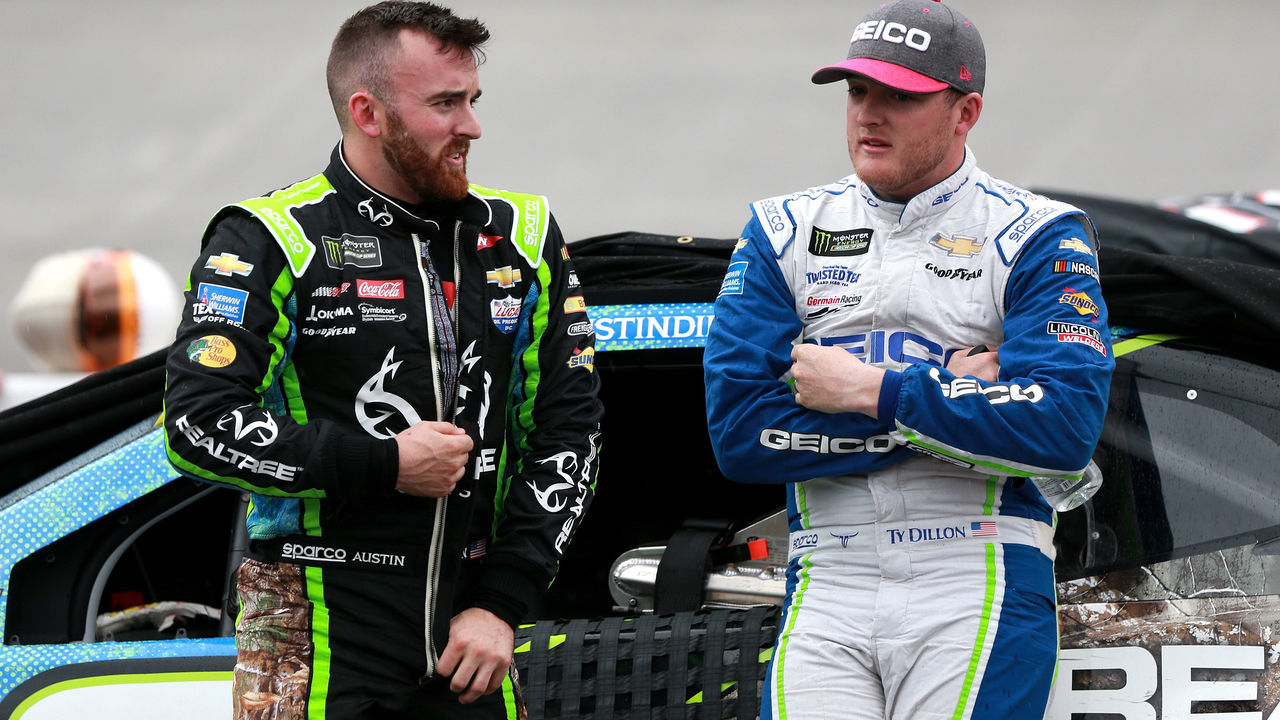 BRISTOL, TN - APRIL 15: Austin Dillon, driver of the #3 Realtree Chevrolet, and Ty Dillon, driver of the #13 GEICO Chevrolet, stand on pit road during a rain delay for the Monster Energy NASCAR Cup Series Food City 500 at Bristol Motor Speedway on April 15, 2018 in Bristol, Tennessee.