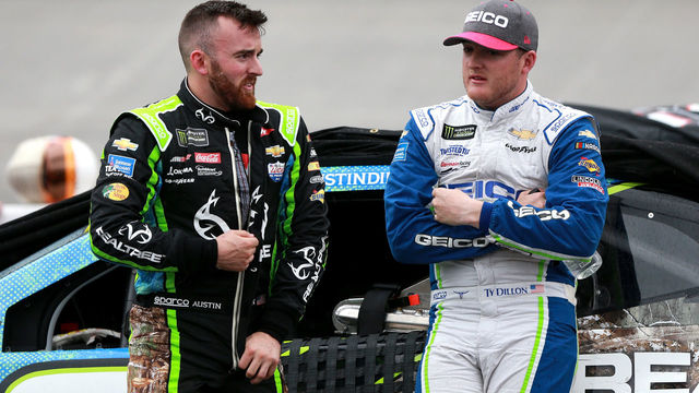 BRISTOL, TN - APRIL 15: Austin Dillon, driver of the #3 Realtree Chevrolet, and Ty Dillon, driver of the #13 GEICO Chevrolet, stand on pit road during a rain delay for the Monster Energy NASCAR Cup Series Food City 500 at Bristol Motor Speedway on April 15, 2018 in Bristol, Tennessee.