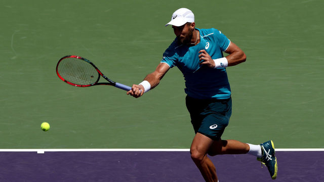 KEY BISCAYNE, FL - MARCH 26: Steve Johnson returns a shot to Pablo Carreno Busta of Spain during the Miami Open Presented by Itau at Crandon Park Tennis Center on March 26, 2018 in Key Biscayne, Florida.