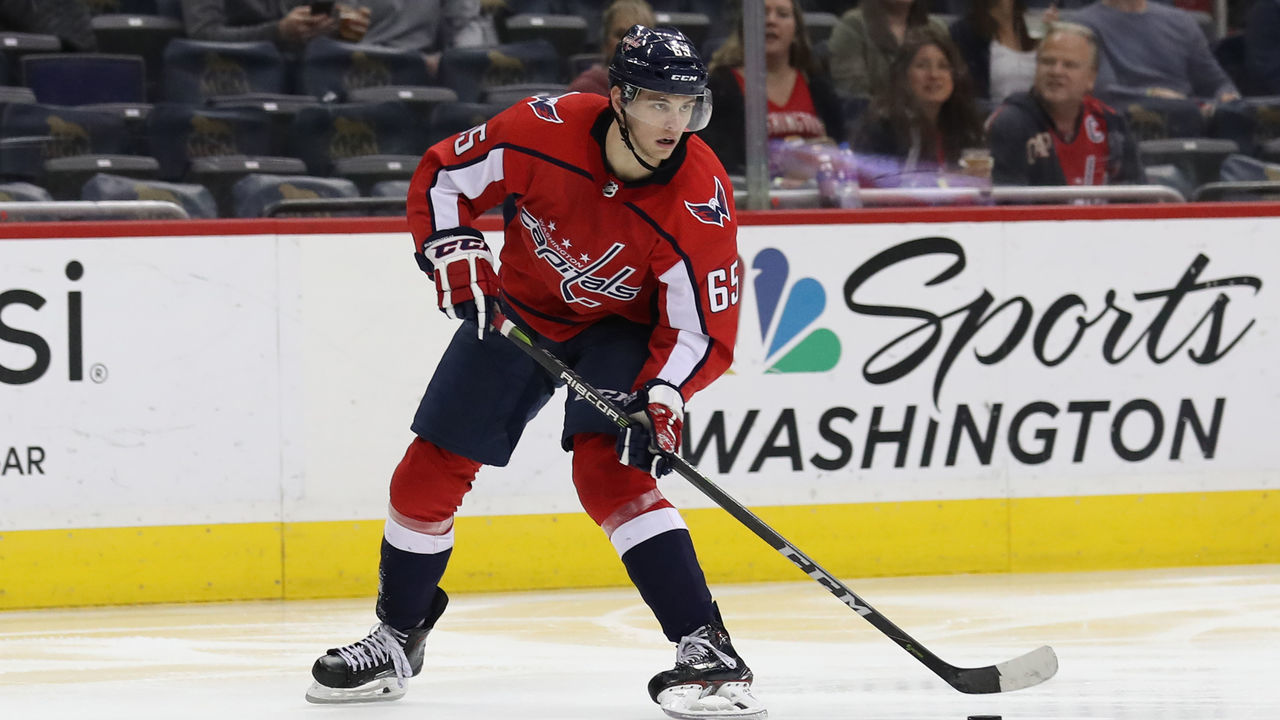 WASHINGTON, DC - MARCH 28: Andre Burakovsky #65 of the Washington Capitals skates with the puck against the New York Rangers at Capital One Arena on March 28, 2018 in Washington, DC.