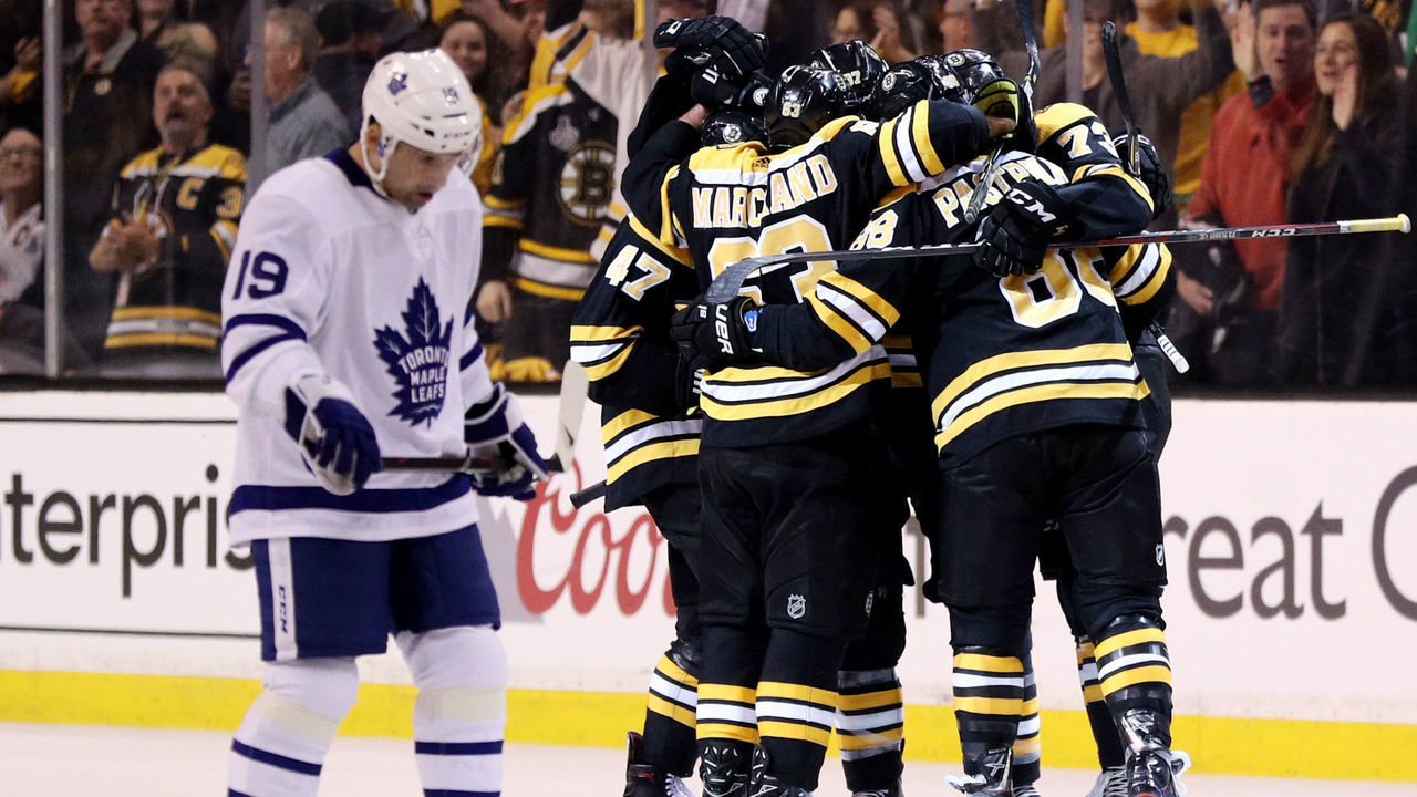 BOSTON, MA - APRIL 12: Tomas Plekanec #19 of the Toronto Maple Leafs reacts as members of the Boston Bruins congratulate David Pastrnak #88 after scoring a goal during the second period of Game One of the Eastern Conference First Round during the 2018 NHL Stanley Cup Playoffs at TD Garden on April 12, 2018 in Boston, Massachusetts.