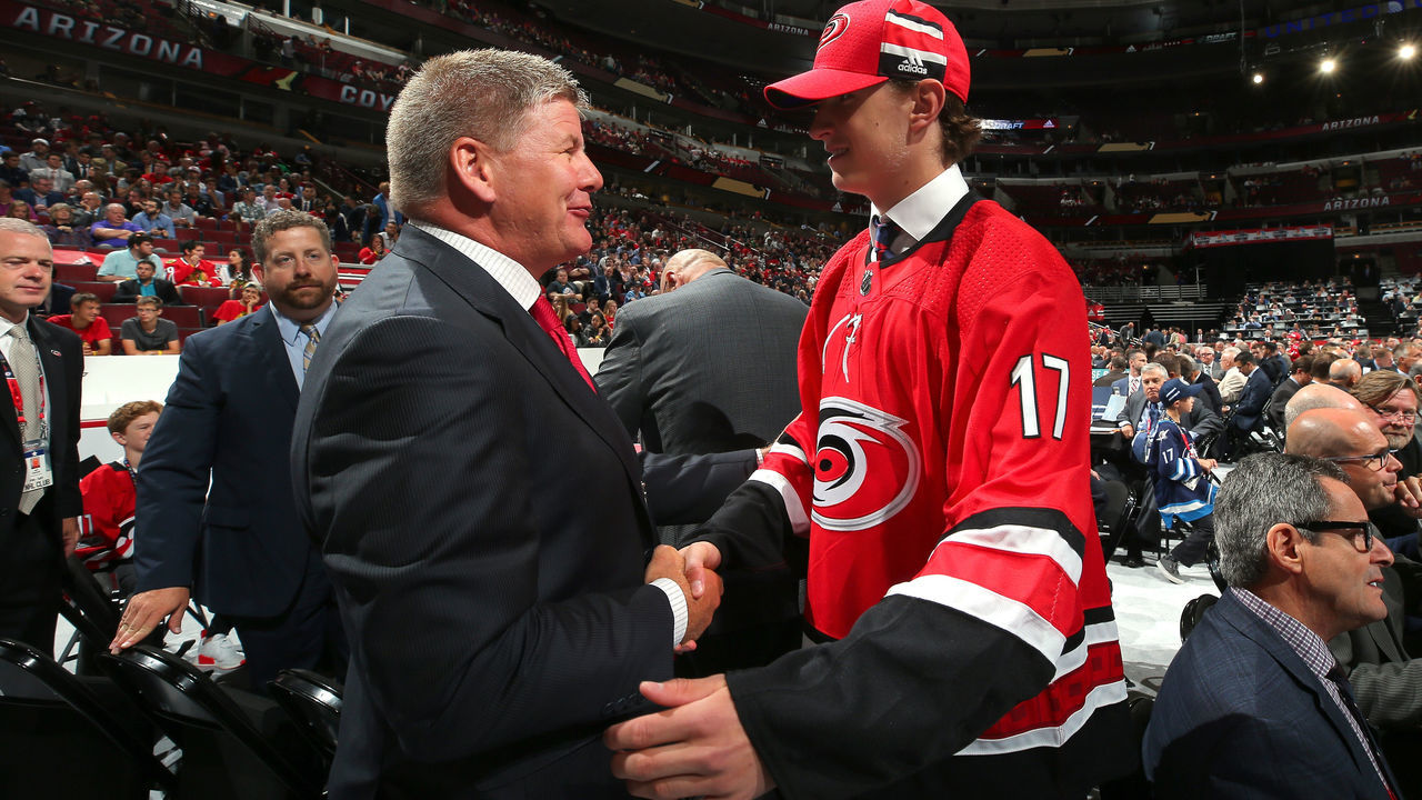 CHICAGO, IL - JUNE 24: Eetu Luostarinen meets with coach Bill Peters after being selected 42nd overall by the Carolina Hurricanes during the 2017 NHL Draft at the United Center on June 24, 2017 in Chicago, Illinois.
