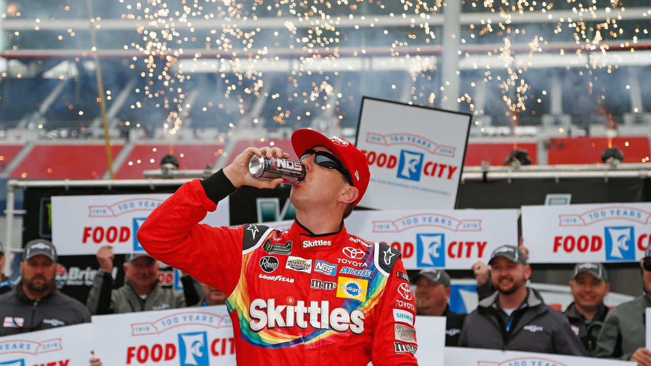 BRISTOL, TN - APRIL 16: Kyle Busch, driver of the #18 Skittles Toyota, celebrates in victory lane after winning the rain delayed Monster Energy NASCAR Cup Series Food City 500 at Bristol Motor Speedway on April 16, 2018 in Bristol, Tennessee.