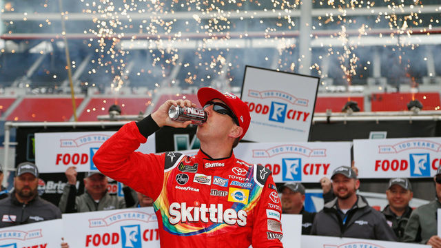 BRISTOL, TN - APRIL 16: Kyle Busch, driver of the #18 Skittles Toyota, celebrates in victory lane after winning the rain delayed Monster Energy NASCAR Cup Series Food City 500 at Bristol Motor Speedway on April 16, 2018 in Bristol, Tennessee.