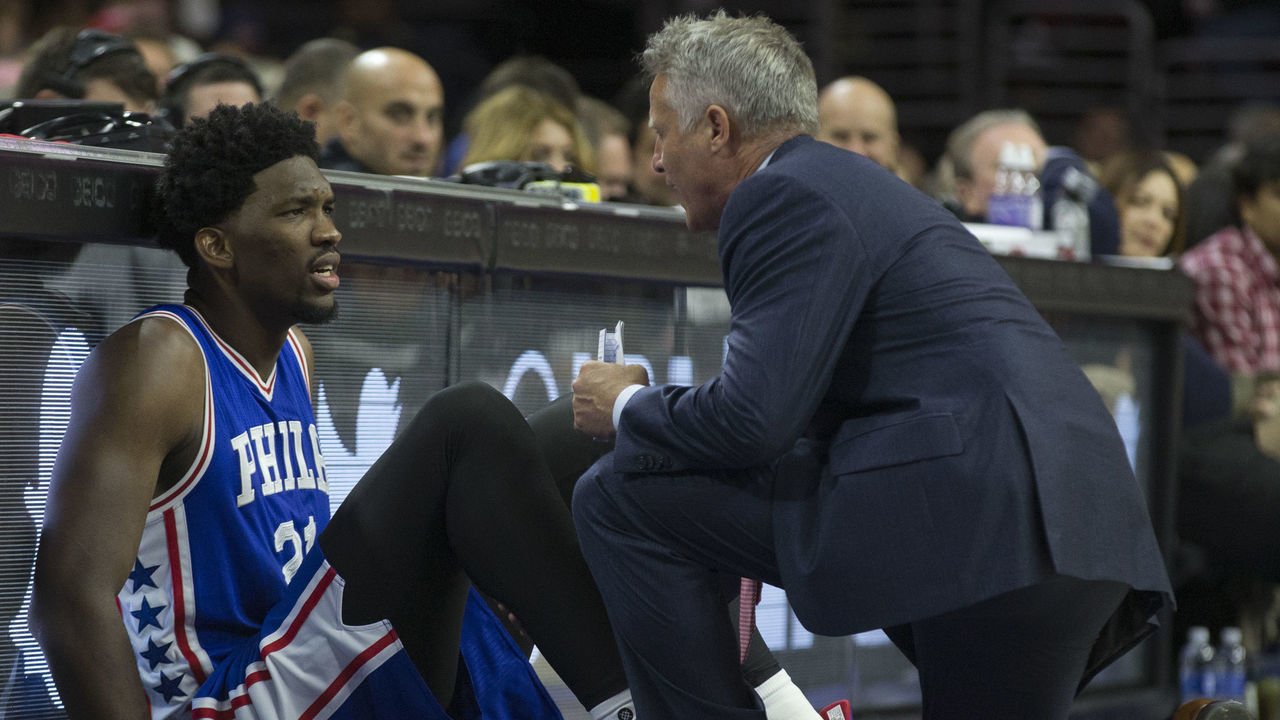 PHILADELPHIA, PA - OCTOBER 26: Head coach Brett Brown of the Philadelphia 76ers talks to Joel Embiid #21 in the fourth quarter against the Philadelphia 76ers at Wells Fargo Center on October 26, 2016 in Philadelphia, Pennsylvania. The Thunder defeated the 76ers 103-97.