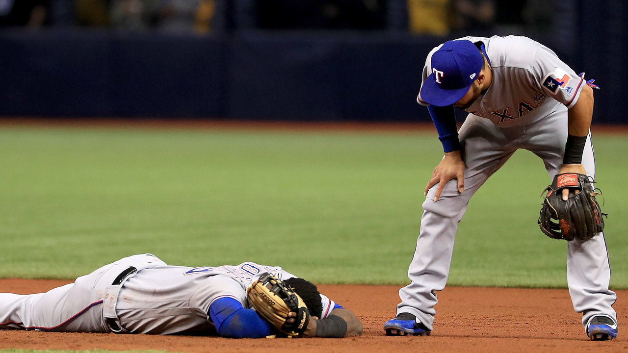 ST PETERSBURG, FL - APRIL 16: Jurickson Profar #19 of the Texas Rangers is injured on a double play in the second inning during a game against the Tampa Bay Rays at Tropicana Field on April 16, 2018 in St Petersburg, Florida.