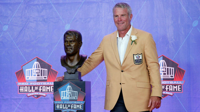 CANTON, OH - AUGUST 06: Brett Favre, former NFL quarterback, poses with his bronze bust during the NFL Hall of Fame Enshrinement Ceremony at the Tom Benson Hall of Fame Stadium on August 6, 2016 in Canton, Ohio.