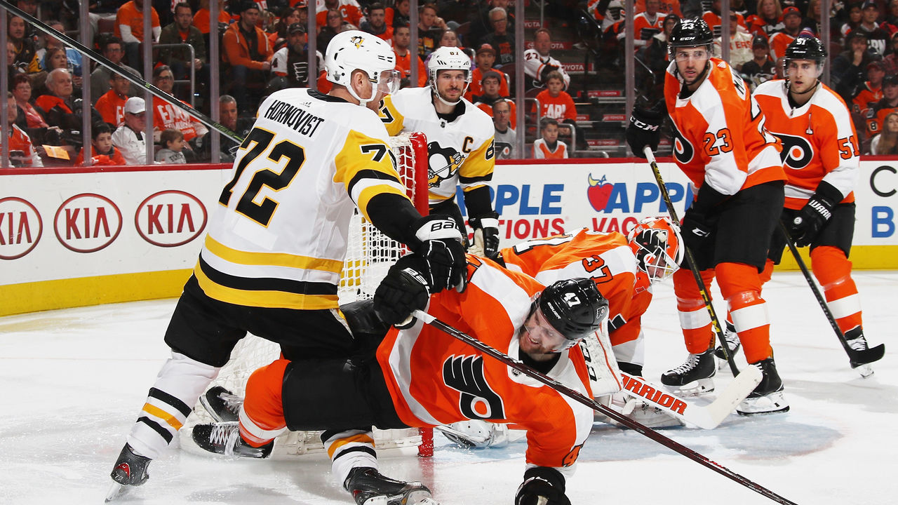PHILADELPHIA, PA - APRIL 15: Andrew MacDonald #47 of the Philadelphia Flyers is checked by Patric Hornqvist #72 of the Pittsburgh Penguins during the third period in Game Three of the Eastern Conference First Round during the 2018 NHL Stanley Cup Playoffs at the Wells Fargo Center on April 15, 2018 in Philadelphia, Pennsylvania. The Penguins defeated the Flyers 5-1.