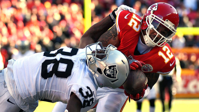 KANSAS CITY, MO - DECEMBER 10: wide receiver Albert Wilson #12 of the Kansas City Chiefs makes a catch as cornerback T.J. Carrie #38 of the Oakland Raiders defends during the game at Arrowhead Stadium on December 10, 2017 in Kansas City, Missouri.