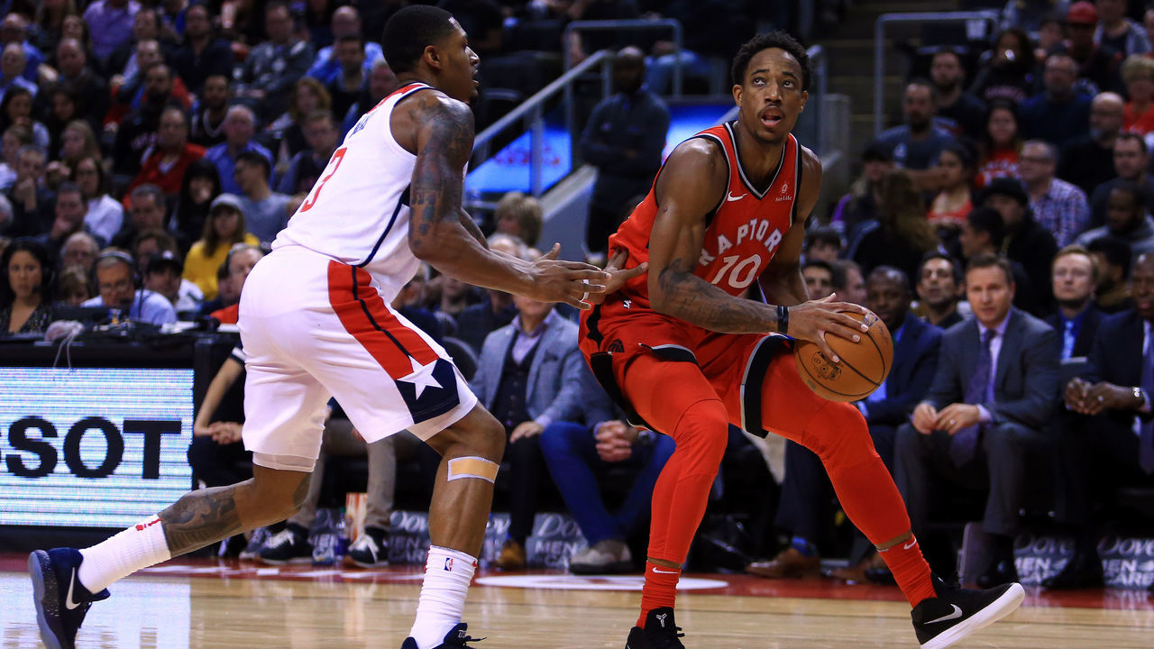 TORONTO, ON - NOVEMBER 05: DeMar DeRozan #10 of the Toronto Raptors dribbles the ball as Bradley Beal #3 of the Washington Wizards defends during the second half of an NBA game at Air Canada Centre on November 5, 2017 in Toronto, Canada.