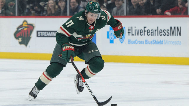ST PAUL, MN - APRIL 2: Zach Parise #11 of the Minnesota Wild controls the puck against the Edmonton Oilers during the game on April 2, 2018 at Xcel Energy Center in St Paul, Minnesota. The Wild defeated the Oilers 3-0.