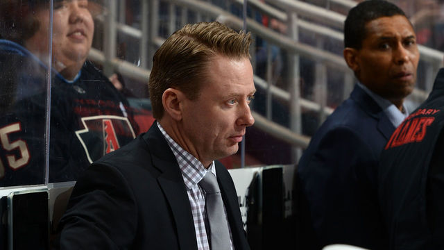 GLENDALE, AZ - MARCH 19: Head coach Glen Gulutzan of the Calgary Flames looks on from the bench against the Arizona Coyotes at Gila River Arena on March 19, 2018 in Glendale, Arizona.