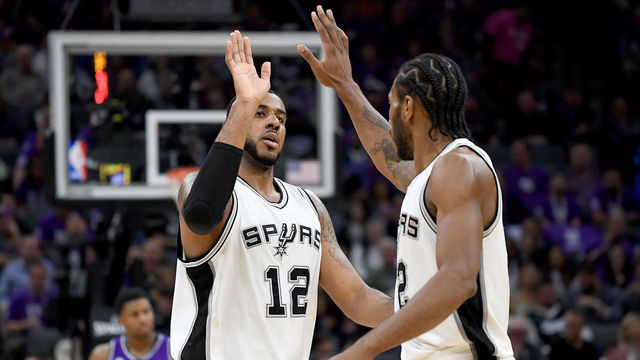SACRAMENTO, CA - OCTOBER 27: Kawhi Leonard #2 of the San Antonio Spurs is congratulated by LaMarcus Aldridge #12 after Leonard scored a basket against the Sacramento Kings during the second quarter of an NBA basketball game at Golden 1 Center on October 27, 2016 in Sacramento, California.