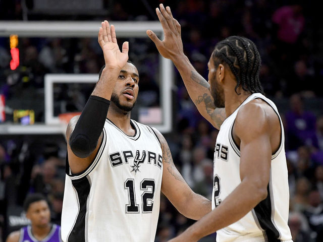 SACRAMENTO, CA - OCTOBER 27: Kawhi Leonard #2 of the San Antonio Spurs is congratulated by LaMarcus Aldridge #12 after Leonard scored a basket against the Sacramento Kings during the second quarter of an NBA basketball game at Golden 1 Center on October 27, 2016 in Sacramento, California.