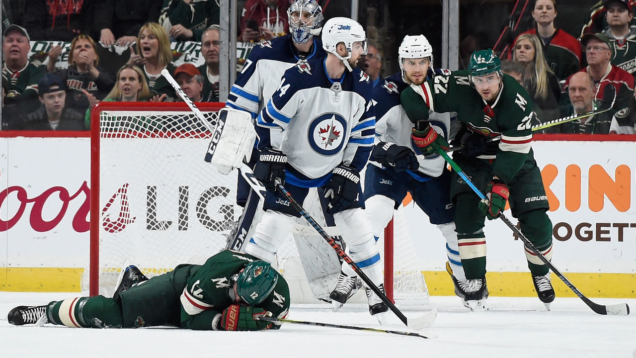 ST PAUL, MN - APRIL 17: Eric Staal #12 of the Minnesota Wild lays on the ice after a check by the Winnipeg Jets during the first period in Game Four of the Western Conference First Round during the 2018 NHL Stanley Cup Playoffs at Xcel Energy Center on April 17, 2018 in St Paul, Minnesota.