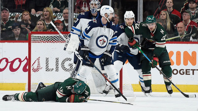 ST PAUL, MN - APRIL 17: Eric Staal #12 of the Minnesota Wild lays on the ice after a check by the Winnipeg Jets during the first period in Game Four of the Western Conference First Round during the 2018 NHL Stanley Cup Playoffs at Xcel Energy Center on April 17, 2018 in St Paul, Minnesota.