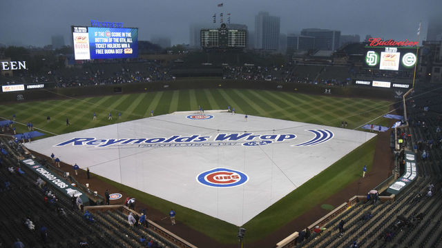CHICAGO, IL - MAY 09: A general view of the field with a tarp on it as it rains before a game between the Chicago Cubs and the San Diego Padres on May 9, 2016 at Wrigley Field in Chicago, Illinois.