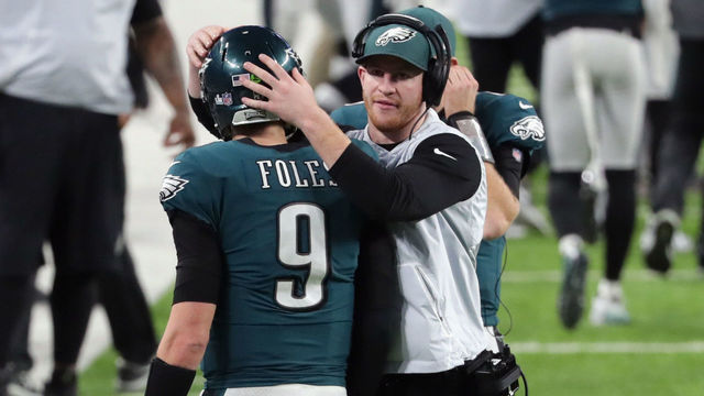 MINNEAPOLIS, MN - FEBRUARY 04: Nick Foles #9 of the Philadelphia Eagles is congratulated by his teammate Carson Wentz #11 after his 11-yard touchdown pass during the fourth quarter against the New England Patriots in Super Bowl LII at U.S. Bank Stadium on February 4, 2018 in Minneapolis, Minnesota.