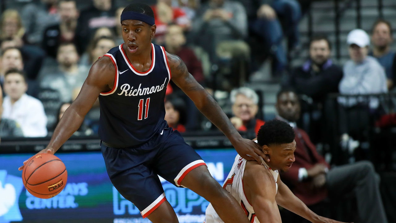 NEW YORK, NY - NOVEMBER 25: De'Monte Buckingham #11 of the Richmond Spiders steals the ball from Justin Jackson #21 of the Maryland Terrapins in the second half during the Barclays Center Classic at Barclays Center on November 25, 2016 in the Brooklyn borough of New York City.