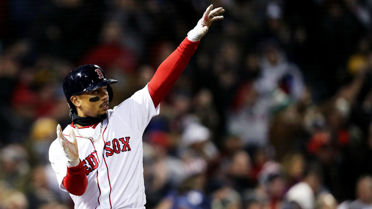 BOSTON, MA - APRIL 10: Mookie Betts #50 of the Boston Red Sox celebrates after scoring a run against the New York Yankees during the sixth inning at Fenway Park on April 10, 2018 in Boston, Massachusetts.