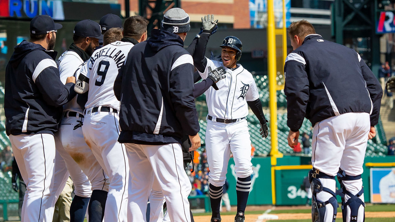 DETROIT, MI - APRIL 18: Dixon Machado #49 of the Detroit Tigers hits a walk off home run in the ninth inning against the Baltimore Orioles and celebrates with teammates at home plate during a MLB game at Comerica Park on April 18, 2018 in Detroit, Michigan. The Tigers defeated the Orioles 6-5.