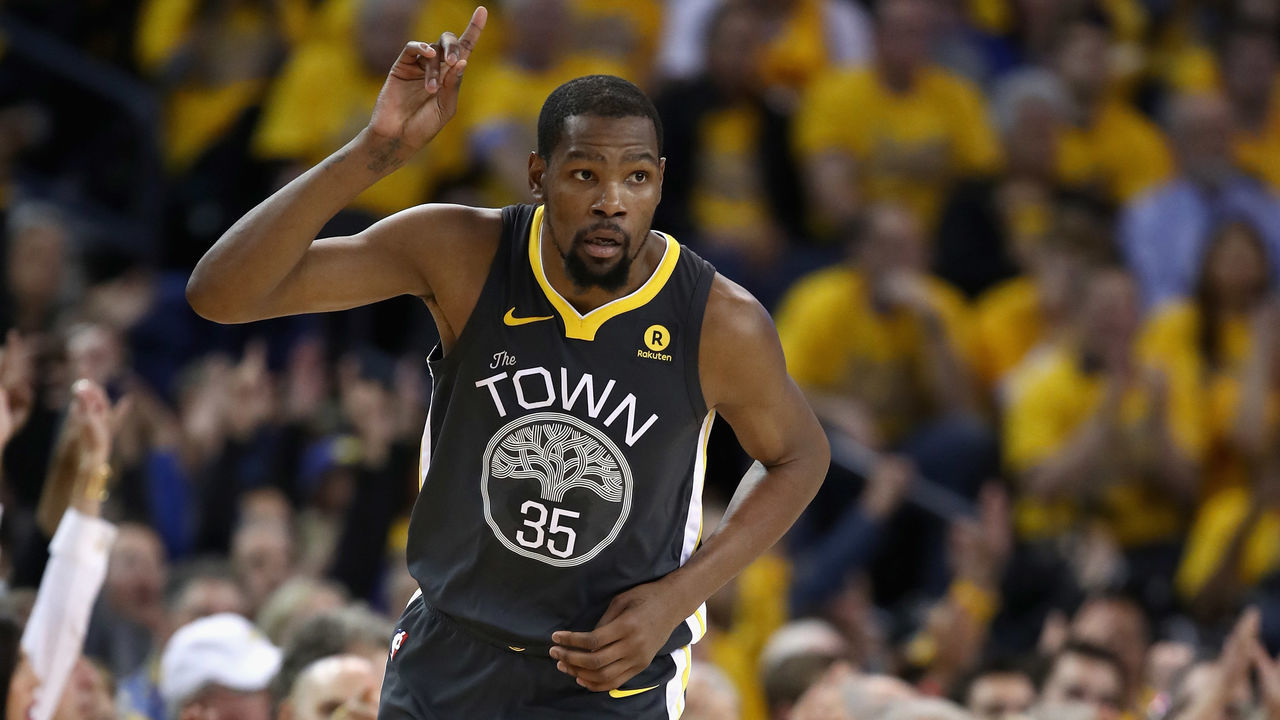 OAKLAND, CA - APRIL 16: Kevin Durant #35 of the Golden State Warriors reacts after he made a three-point basket against the San Antonio Spurs during Game 2 of Round 1 of the 2018 NBA Playoffs at ORACLE Arena on April 16, 2018 in Oakland, California.