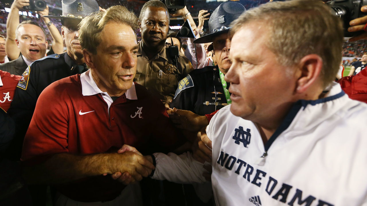 MIAMI GARDENS, FL - JANUARY 07: Head coach Nick Saban (L) of the Alabama Crimson Tide and head coach Jim Kelly of the Notre Dame Fighting Irish shake hands after the 2013 Discover BCS National Championship game at Sun Life Stadium on January 7, 2013 in Miami Gardens, Florida. Alabama won the game by a score of 42-14.