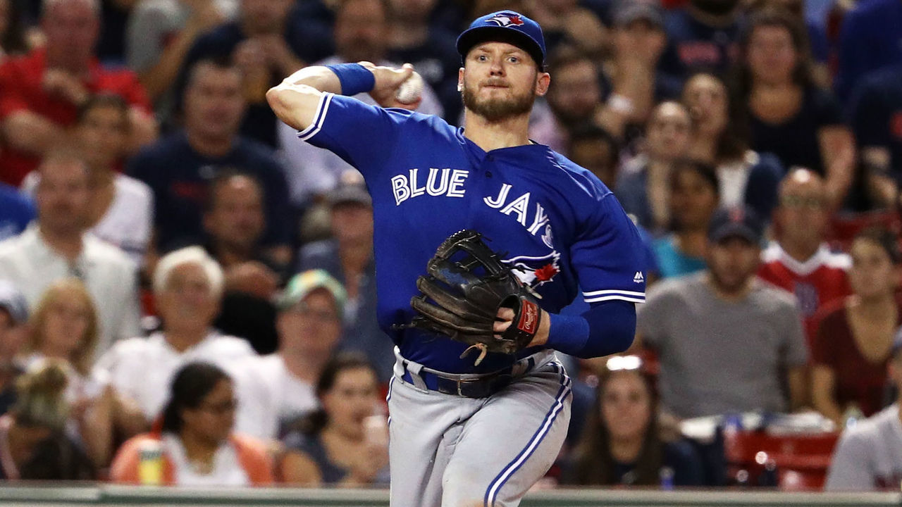 BOSTON, MA - SEPTEMBER 26: Josh Donaldson #20 of the Toronto Blue Jays throws to first to force out Andrew Benintendi #16 of the Boston Red Sox during the fourth inning at Fenway Park on September 26, 2017 in Boston, Massachusetts.