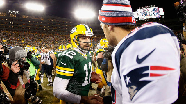 GREEN BAY, WI - NOVEMBER 30: Quarterbacks Aaron Rodgers #12 of the Green Bay Packers and Tom Brady #12 of the New England Patriots shake hands following the NFL game at Lambeau Field on November 30, 2014 in Green Bay, Wisconsin. The Packers defeated the Patriots 26-21.
