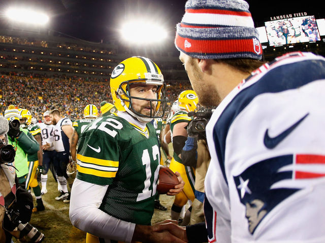 GREEN BAY, WI - NOVEMBER 30: Quarterbacks Aaron Rodgers #12 of the Green Bay Packers and Tom Brady #12 of the New England Patriots shake hands following the NFL game at Lambeau Field on November 30, 2014 in Green Bay, Wisconsin. The Packers defeated the Patriots 26-21.