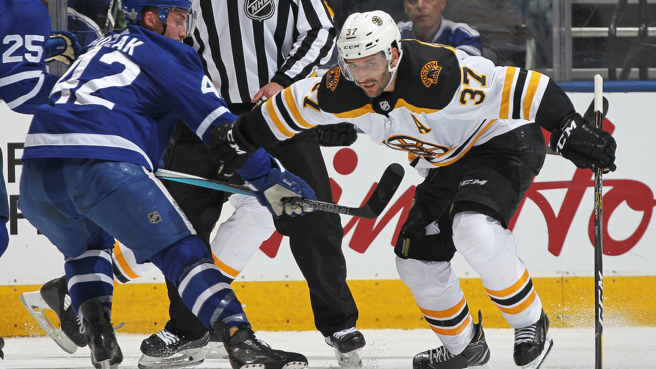 TORONTO, ON - APRIL 16: Patrice Bergeron #37 of the Boston Bruins skates against Tyler Bozak #42 of the Toronto Maple Leafs in Game Three of the Eastern Conference First Round during the 2018 Stanley Cup Play-offs at the Air Canada Centre on April 16, 2018 in Toronto, Ontario, Canada. The Maple Leafs defeated the Bruins 4-2. *** Local Caption *** Patrice Bergeron; Tyler Bozak