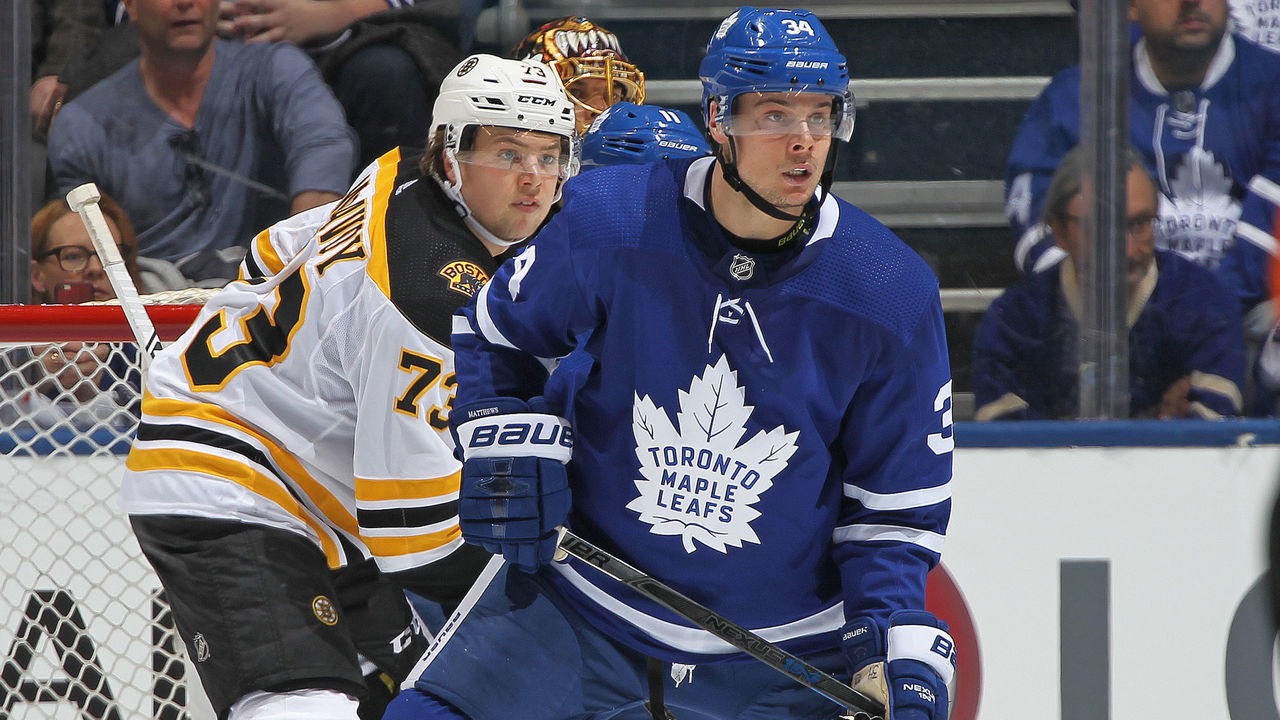 TORONTO, ON - APRIL 16: Auston Matthews #34 of the Toronto Maple Leafs looks for a puck to tip in front of Charlie McAvoy #73 of the Boston Bruins in Game Three of the Eastern Conference First Round during the 2018 Stanley Cup Play-offs at the Air Canada Centre on April 16, 2018 in Toronto, Ontario, Canada. The Maple Leafs defeated the Bruins 4-2.