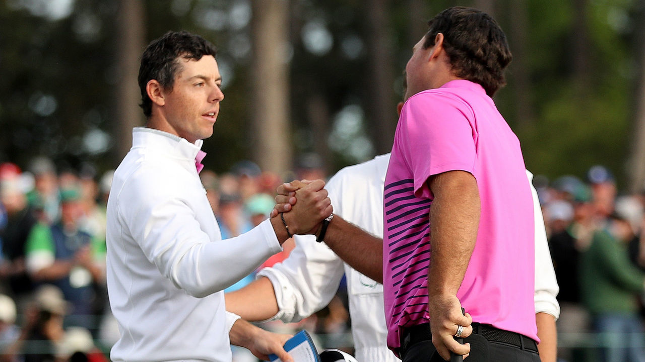 AUGUSTA, GA - APRIL 08: Patrick Reed of the United States and Rory McIlroy of Northern Ireland shake hands on the 18th green during the final round of the 2018 Masters Tournament at Augusta National Golf Club on April 8, 2018 in Augusta, Georgia.