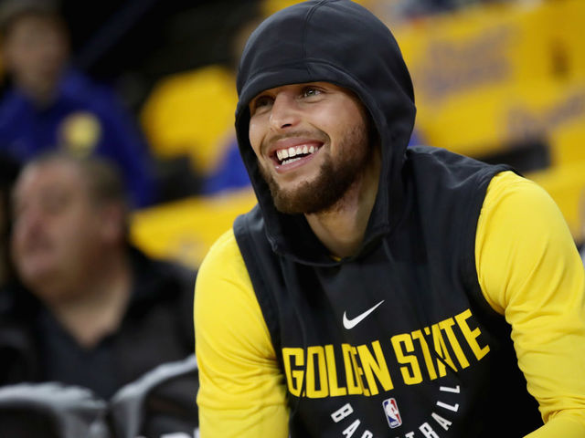 OAKLAND, CA - APRIL 16: Stephen Curry #30 of the Golden State Warriors sits on the bench before their game against the San Antonio Spurs in Game 2 of Round 1 of the 2018 NBA Playoffs at ORACLE Arena on April 16, 2018 in Oakland, California. Curry is still out with an injury.