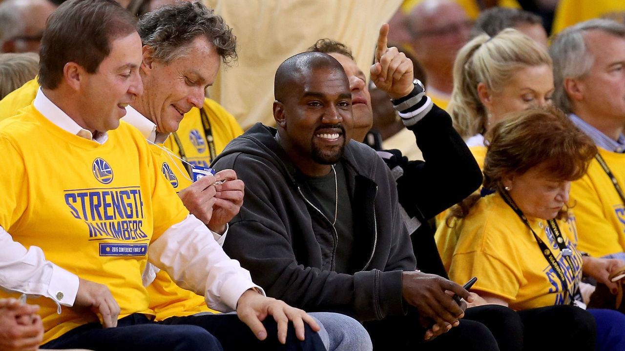 OAKLAND, CA - MAY 27: Rapper Kanye West sits courtside for game five of the Western Conference Finals of the 2015 NBA Playoffs at ORACLE Arena on May 27, 2015 in Oakland, California. NOTE TO USER: User expressly acknowledges and agrees that, by downloading and or using this photograph, user is consenting to the terms and conditions of Getty Images License Agreement.