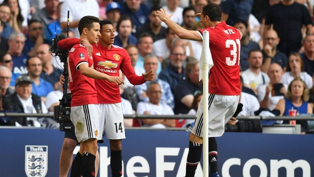 Manchester United's Spanish midfielder Ander Herrera (L) celebrates with Manchester United's English midfielder Jesse Lingard (C) and Manchester United's Serbian midfielder Nemanja Matic after scoring the team's second goal during the English FA Cup semi-final football match between Tottenham Hotspur and Manchester United at Wembley Stadium in London, on April 21, 2018.