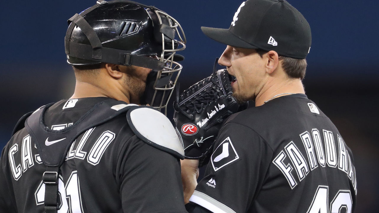 TORONTO, ON - APRIL 2: Danny Farquhar #43 of the Chicago White Sox talks with Welington Castillo #21 as he comes into the game in the seventh inning during MLB game action against the Toronto Blue Jays at Rogers Centre on April 2, 2018 in Toronto, Canada.